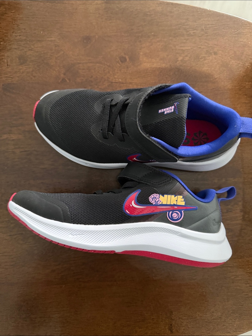 Nike Kids Black Sneakers with Purple and Pink Accents